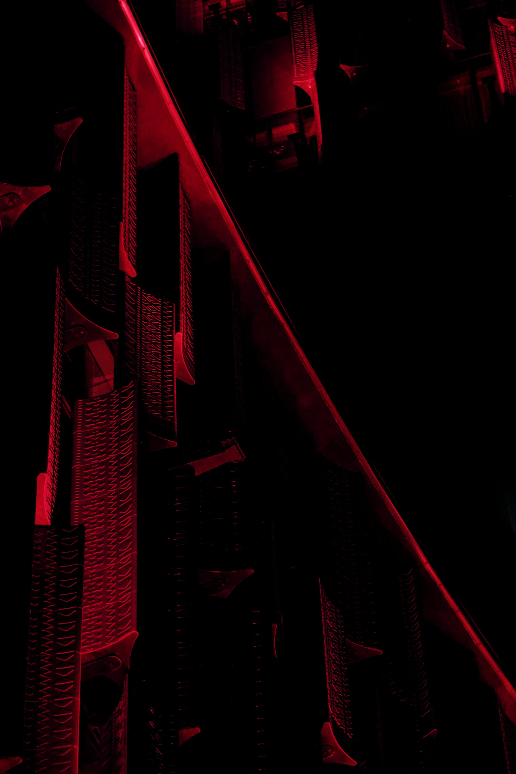 Abstract architectural surface illuminated by red light